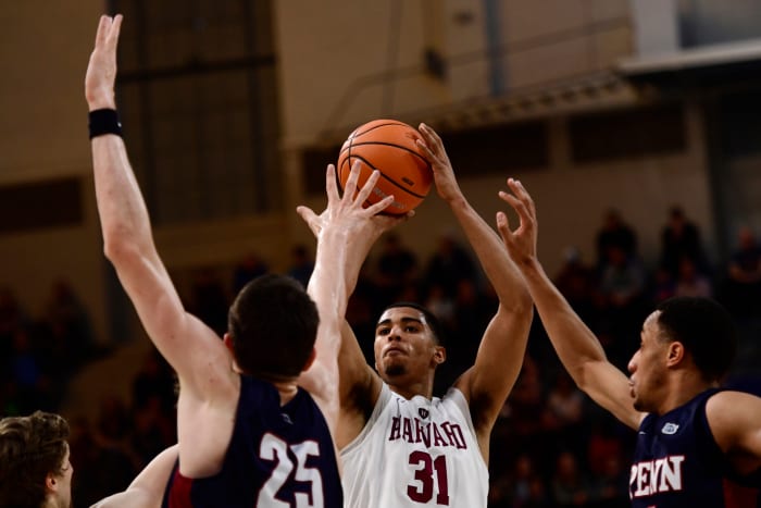 Seth Towns shoots the ball in a game for Harvard.