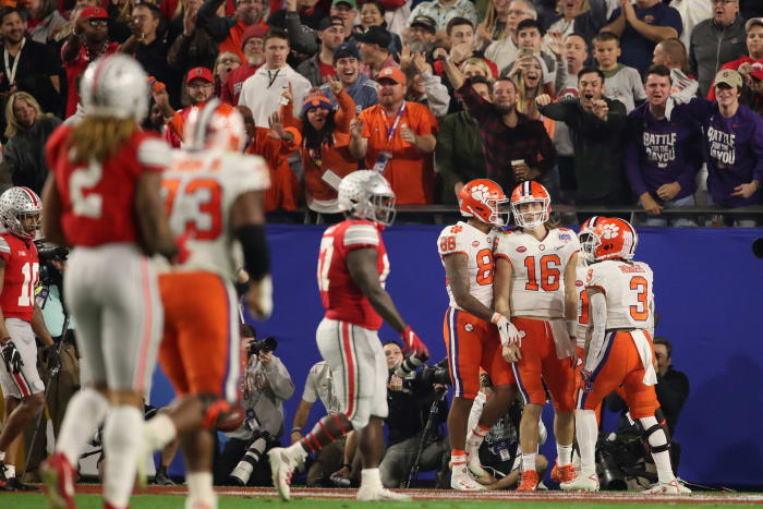 Ohio State and Clemson players on the field in the Fiesta Bowl.