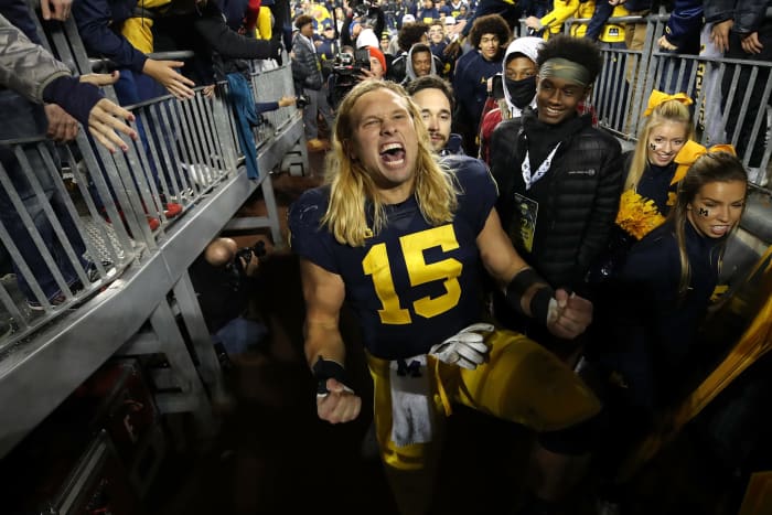 michigan star chase winovich celebrates a win over wisconsin