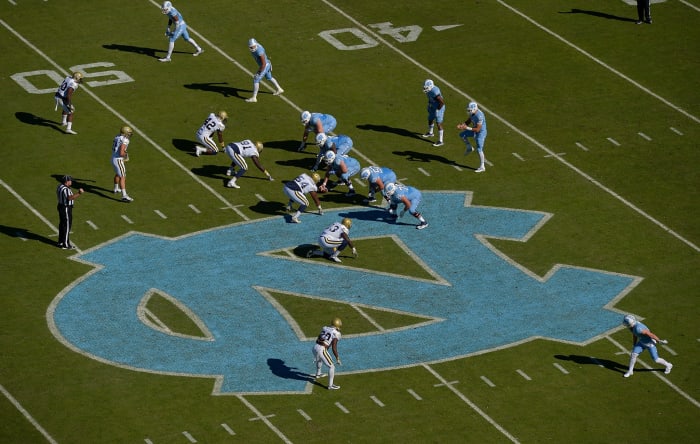 North Carolina quarterback takes the snap against Georgia Tech.