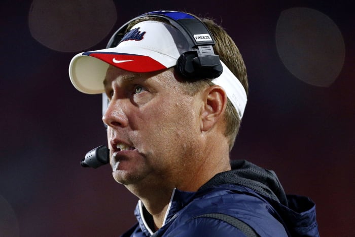 A closeup of Hugh Freeze wearing an Ole Miss visor.