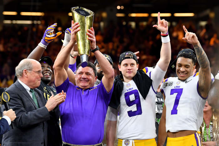 LSU football head coach Ed Orgeron and QB Joe Burrow celebrate college football national title.