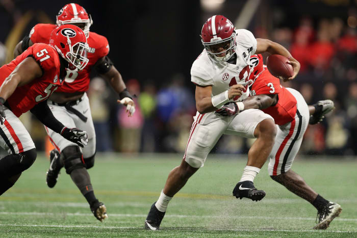 Tua Tagovailoa running with the football