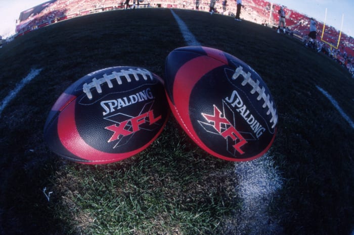 Two XFL footballs.