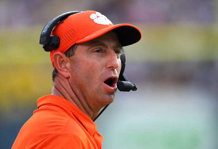 Dabo Swinney speaks on the sideline.