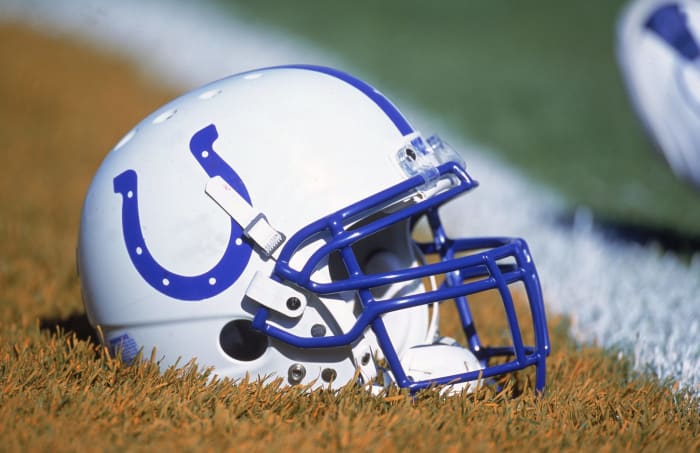 An Indianapolis Colts helmet sitting on the field.