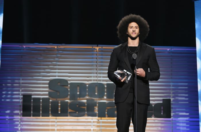 Colin Kaepernick accepting an award.