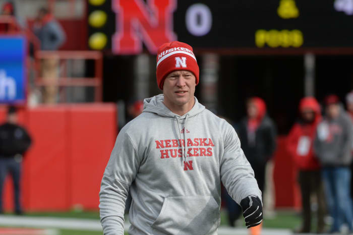 Scott Frost wearing Nebraska gear coaching against Illinois.
