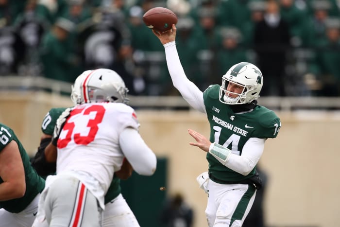 Brian Lewerke throws a pass against Ohio State.