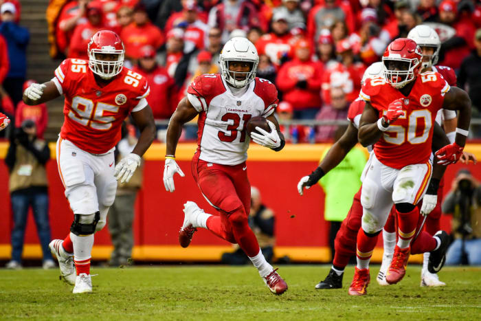 David Johnson running with the football.