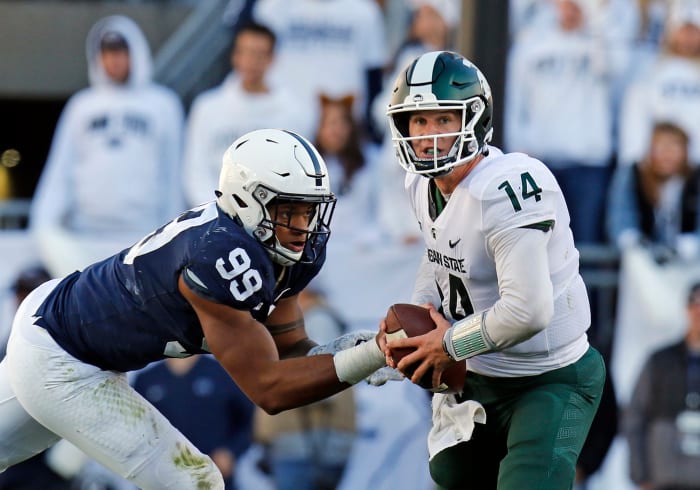 Yetur Gross-Matos puts pressure on Brian Lewerke.