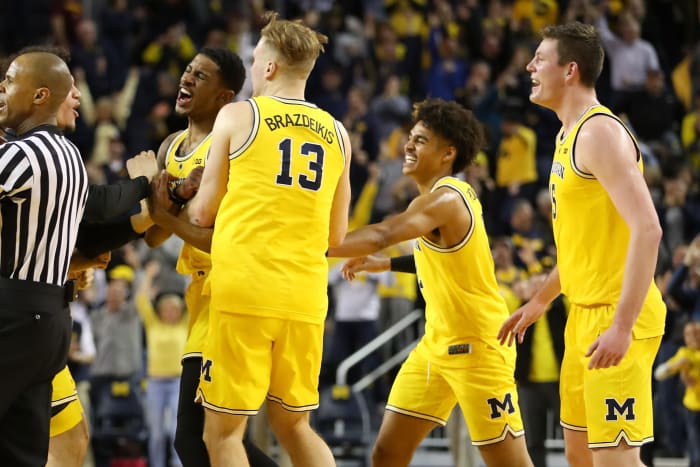 Charles Matthews celebrates with Ignas Brazdeikis of the Michigan Wolverines.