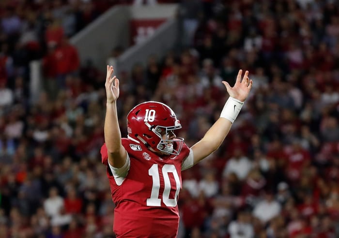 Mac Jones celebrates a touchdown throw for Alabama football.