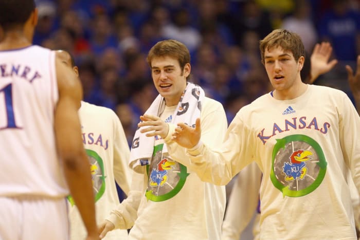 Kansas' Chase Buford greets his teammates.