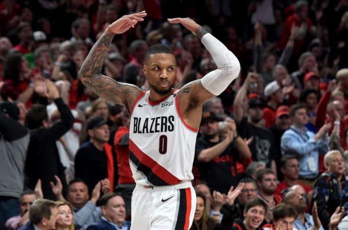 Damian Lillard celebrating after scoring.