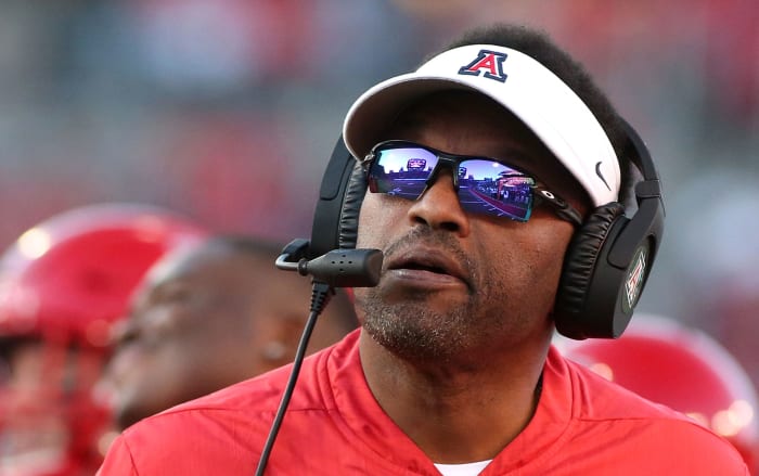 A closeup of Kevin Sumlin wearing an Arizona Cardinals visor.