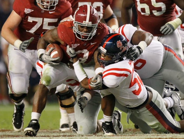Trent Richardson runs the ball for Alabama against OIe Miss.
