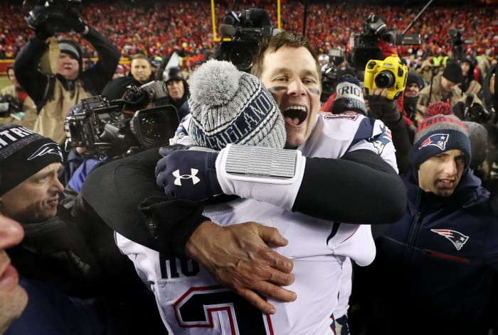 tom brady celebrates the afc championship, hugging Brian Hoyer, his backup.