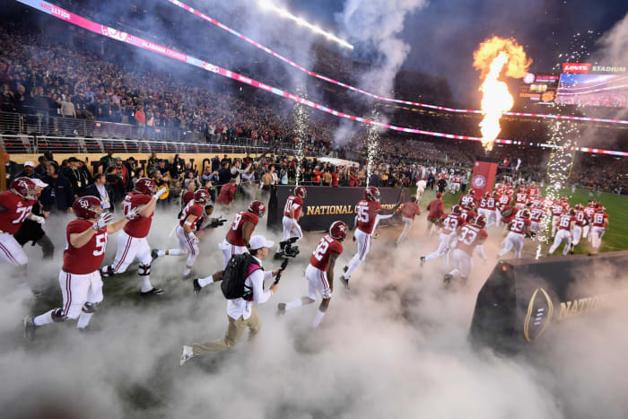 alabama football runs onto the field before the national championship.