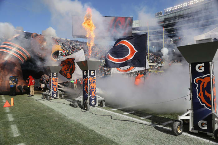 A picture being taken as the Chicago Bears run onto the field.