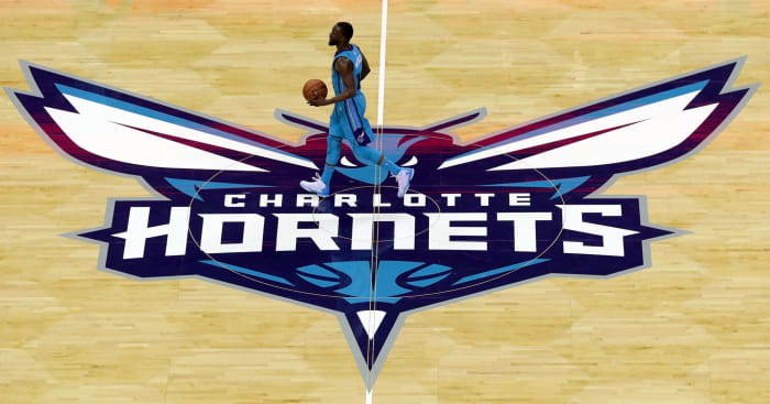 Kemba Walker dribbling at the Charlotte Hornets center court