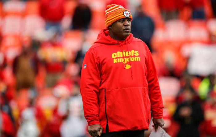 Eric Bieniemy watches pregame warmups.