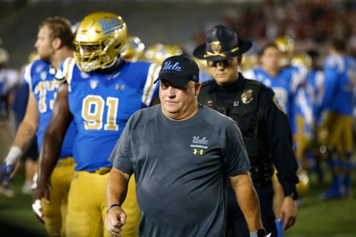 UCLA head coach Chip Kelly walks off the field after loss to Oklahoma.