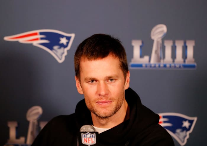 tom brady addresses reporters at the super bowl