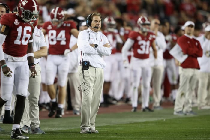 Nick Saban standing on the alabama sideline.