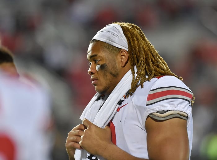Ohio State star Chase Young walks off the field.