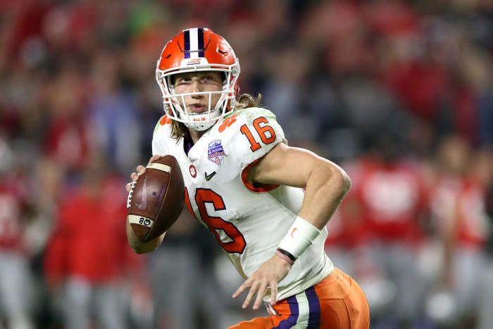 Trevor Lawrence rolls out in the first half against Ohio State.
