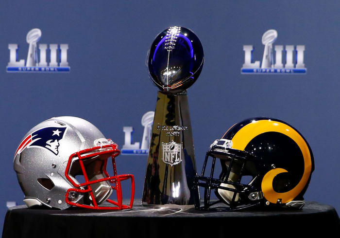 ATLANTA, GA - JANUARY 30: Detail of the Lombardi Trophy and the helmets of the New England Patriots (left) and the Los Angeles Rams priot to NFL Commissioner Roger Goodell speaking during a press conference during Super Bowl LIII Week at the NFL Media Center inside the Georgia World Congress Center on January 30, 2019 in Atlanta, Georgia. (Photo by Mike Zarrilli/Getty Images)