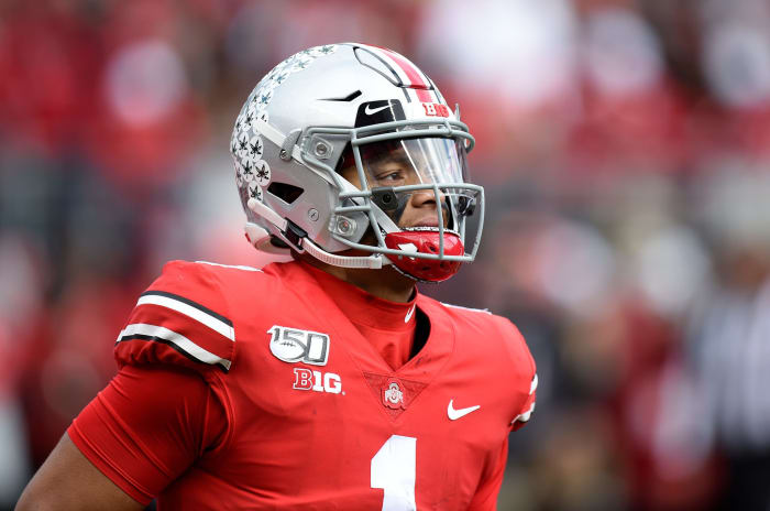 Ohio State football star Justin Fields walks onto the field at Ohio Stadium in Columbus.