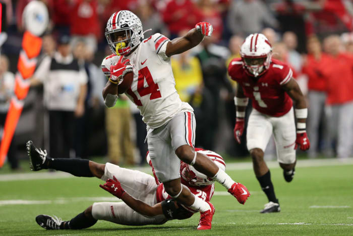 K.J. Hill evades a Wisconsin defensive back during the Big Ten Championship.