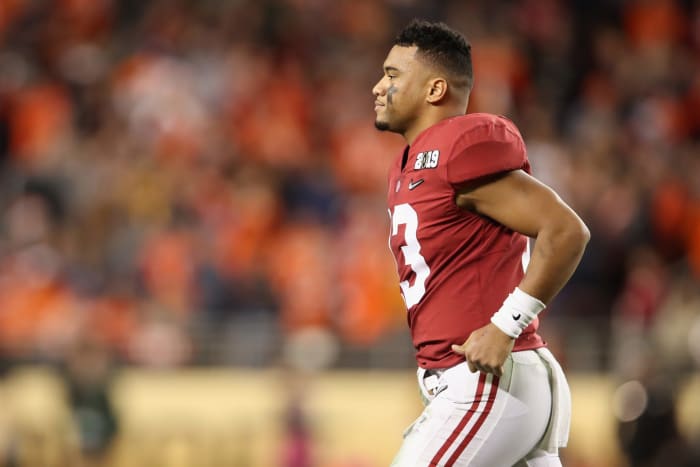 Alabama NFL Draft hopeful Tua Tagovailoa running on the field without his helmet on.