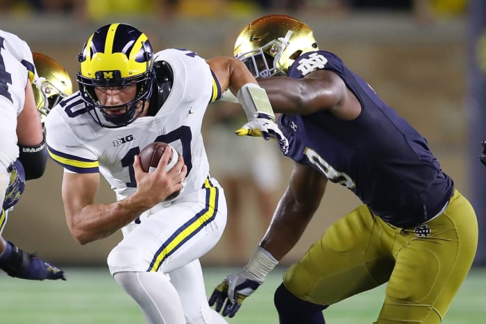 Notre Dame's Daelin Hayes chases Michigan quarterback.