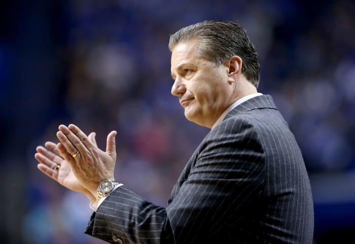 A closeup of Coach Cal clapping.
