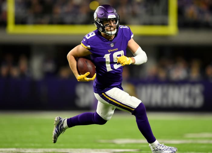 Adam Thielen running with the ball.