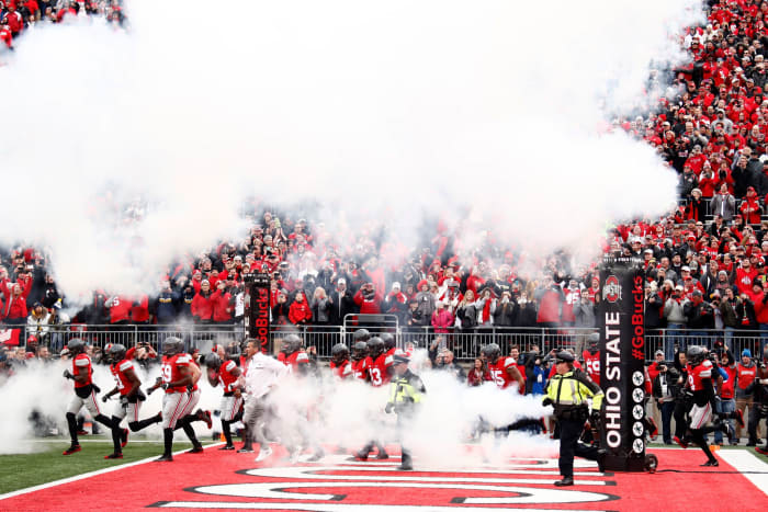 Ohio State players running onto the field before a game.