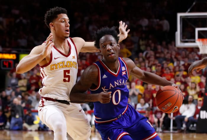 Marcus Garrett of the Kansas Jayhawks drives against Iowa State's Lindell Wigginton.