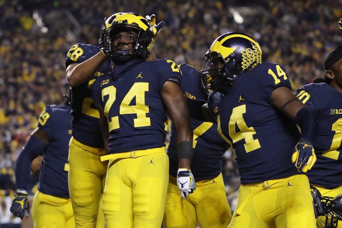Michigan CB Lavert Hill celebrates after scoring defensive touchdown.