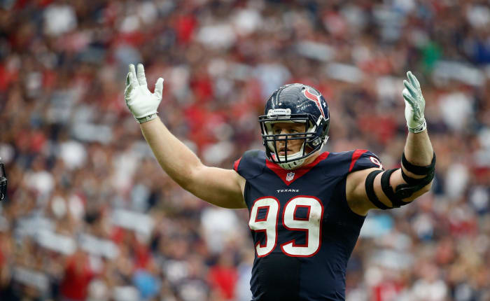 J.J. Watt raising his arms.