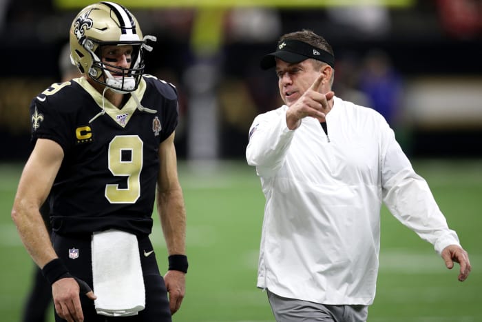 Sean Payton talking to Drew Brees before a Saints game.