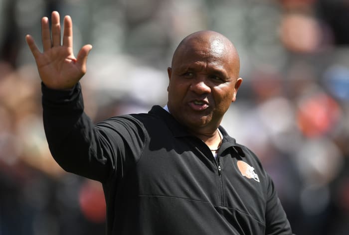 Hue Jackson waving to fans.
