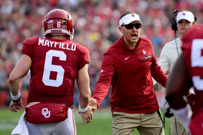 Baker Mayfield and Lincoln Riley shake hands during the Rose Bowl.