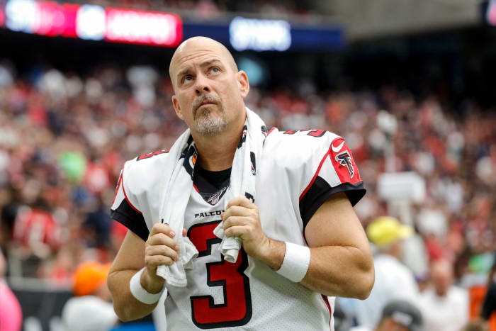 Matt Bryant looks at the scoreboard walking off the field.