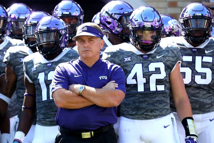 Gary Patterson standing with his arms folded.