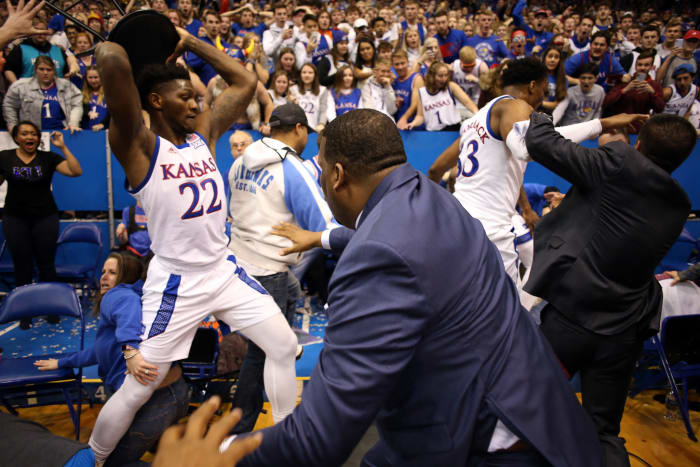 Silvio De Sousa holds a chair over his head during brawl.