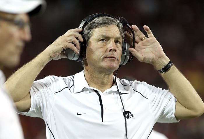 A closeup of Kirk Ferentz on the sideline during a football game.