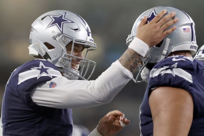 Dak Prescott and La'el Collins celebrate a Dallas Cowboys touchdown.